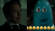 a man in a suit and tie next to a picture of a blue ghost with red eyes