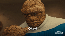 the thing says okay in front of a fantastic four poster