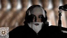 a man with a beard is wearing headphones