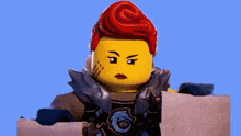 a lego woman with red hair is holding a piece of paper and looking at the camera .