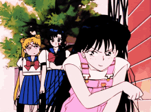 a girl in pink overalls with a heart on the front sits in front of two other girls