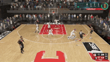 a basketball game is being played on a court that has the letter c on it