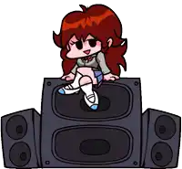 a girl is sitting on top of a speaker