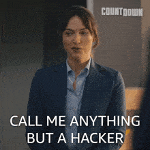 a woman in a suit says call me anything but hacker