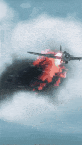 a plane is flying through a cloudy sky with smoke coming out of its engine