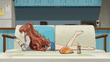 a woman is laying on a couch with a bag of chips and a drink