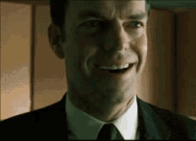 Agent Smith - Evil Laugh GIF - The Matrix Hugo Weaving GIFs