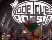 a group of people are standing in front of a sign that says ' code love ' on it