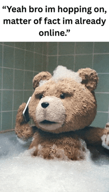 a teddy bear is talking on a cell phone in a bath tub