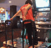 a man in a red shirt with the word arcade on the back