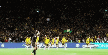 a group of soccer players are running on a field in front of a sign that says sonic