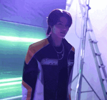 a young man wearing a jacket that says cooper on it