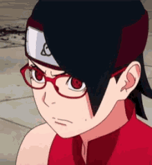 the girl is wearing glasses and a headband .