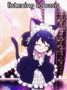 a girl dressed as a cat is holding a microphone and singing .