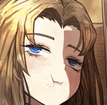 a close up of a girl 's face with blue eyes and brown hair
