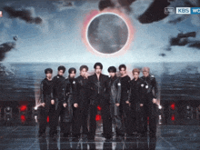 a group of men are standing on a stage with a live kbs logo behind them