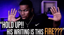 a man wearing glasses and a nike shirt is making a funny face while holding up his hands and says " hold up "