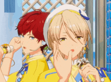 two anime characters one with red hair and the other with blonde hair