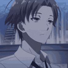 a close up of a boy 's face with a serious look on his face
