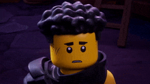 a close up of a lego figure with black hair and a scarf around his neck