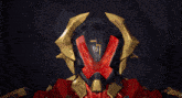 a red and gold robot with the letter o on it