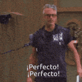 a man wearing glasses and a blue shirt says perfecto perfecto