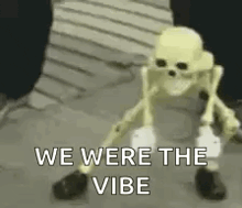 a skeleton is standing on a sidewalk with the words `` we were the vibe '' written on it .