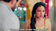 a woman is talking to a man and says " curses him under her breath * "