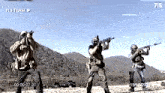 a group of soldiers are standing in a field with their guns and the number 715 is on the screen
