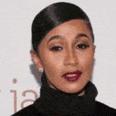 a close up of a woman 's face wearing a black turtleneck sweater and red lipstick .