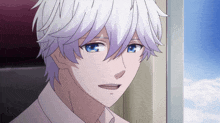 a man with white hair and blue eyes is smiling