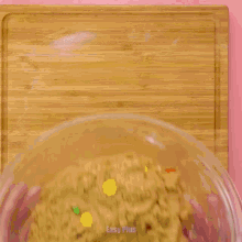 a person is cutting a piece of cookie dough with a cookie cutter