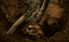 a stuffed animal is laying upside down in a pile of dirt