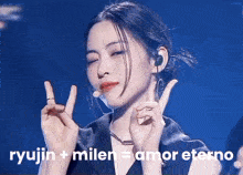 a woman making a peace sign with her fingers and the words ryujin + milen = amor eterno