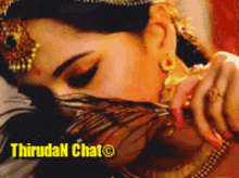 a close up of a woman 's face with the words thiruda n chat on the bottom right