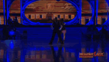 a man and a woman are dancing on a dance legends tv show