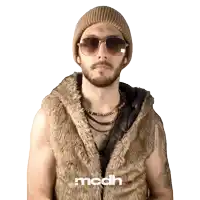 a man wearing sunglasses and a fur vest with the letters mcdh on the bottom