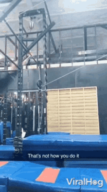 a trampoline with a caption that says that 's not how you do it viralhog