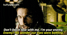 a man with a beard is saying `` don 't fall in love with me , i 'm your enemy . ''