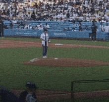 a baseball player wearing number 25 throws a ball