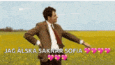 a man in a suit and tie is standing in a field of flowers .