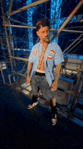 a man wearing a shirt that says abs on it