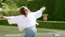 a woman with her arms outstretched is featured in a nbc destination x ad