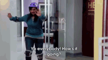 a woman wearing roller skates and knee pads says yo everybody how 's it going