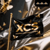 a black flag that says xcs excellent collaboration of singers on it