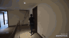 a man is walking down a hallway with the words made in animotica on the bottom