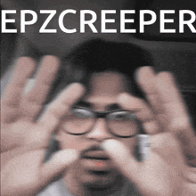 a blurry picture of a man with glasses and the words epzcreeper