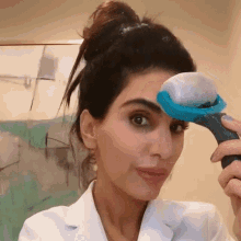 Using A Roller On My Face Dr Azadeh Shirazi GIF - Using A Roller On My Face Dr Azadeh Shirazi Skincare By Dr Azi GIFs