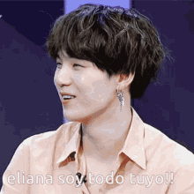 a close up of a person 's face with the words eliana soy todo tuyo on the bottom
