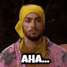 a man wearing a yellow bandana and a pink shirt says aha ...